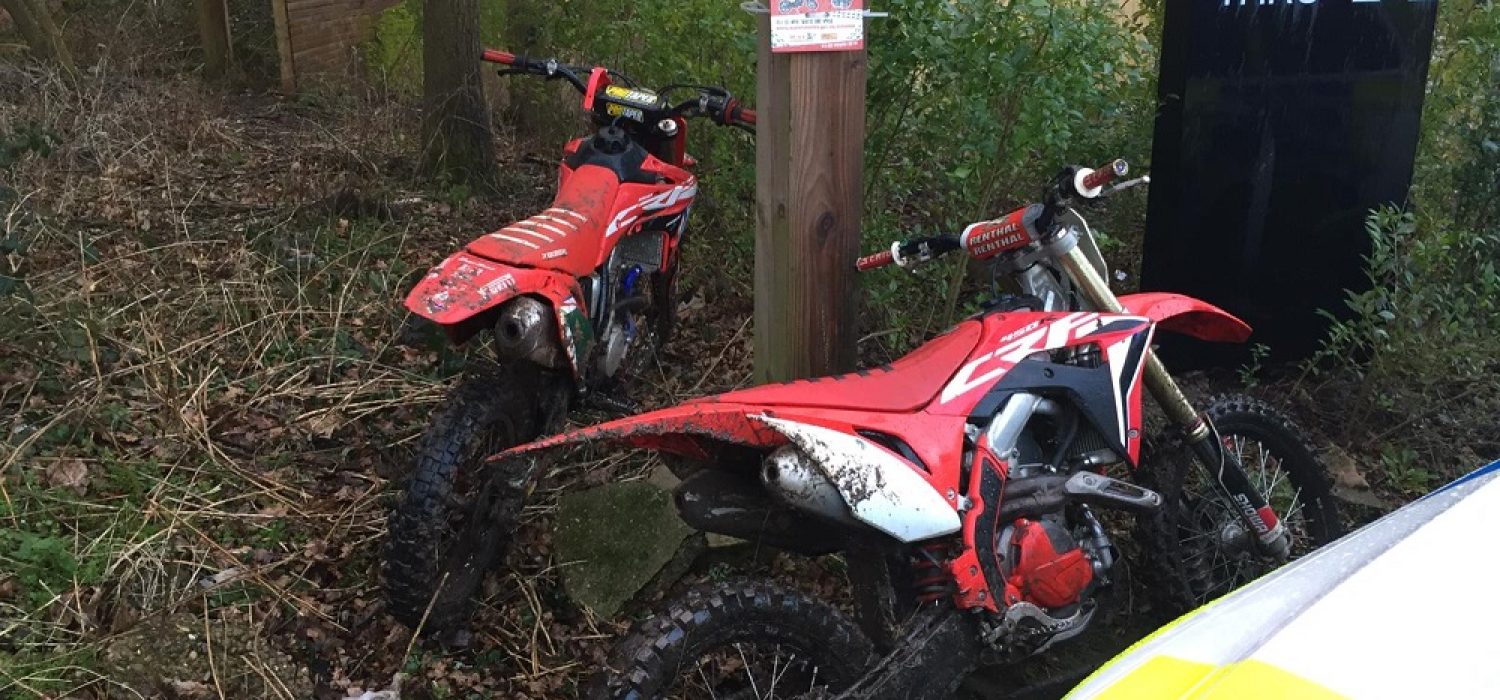 2 off road bikes next to nuisance motorbikes sign