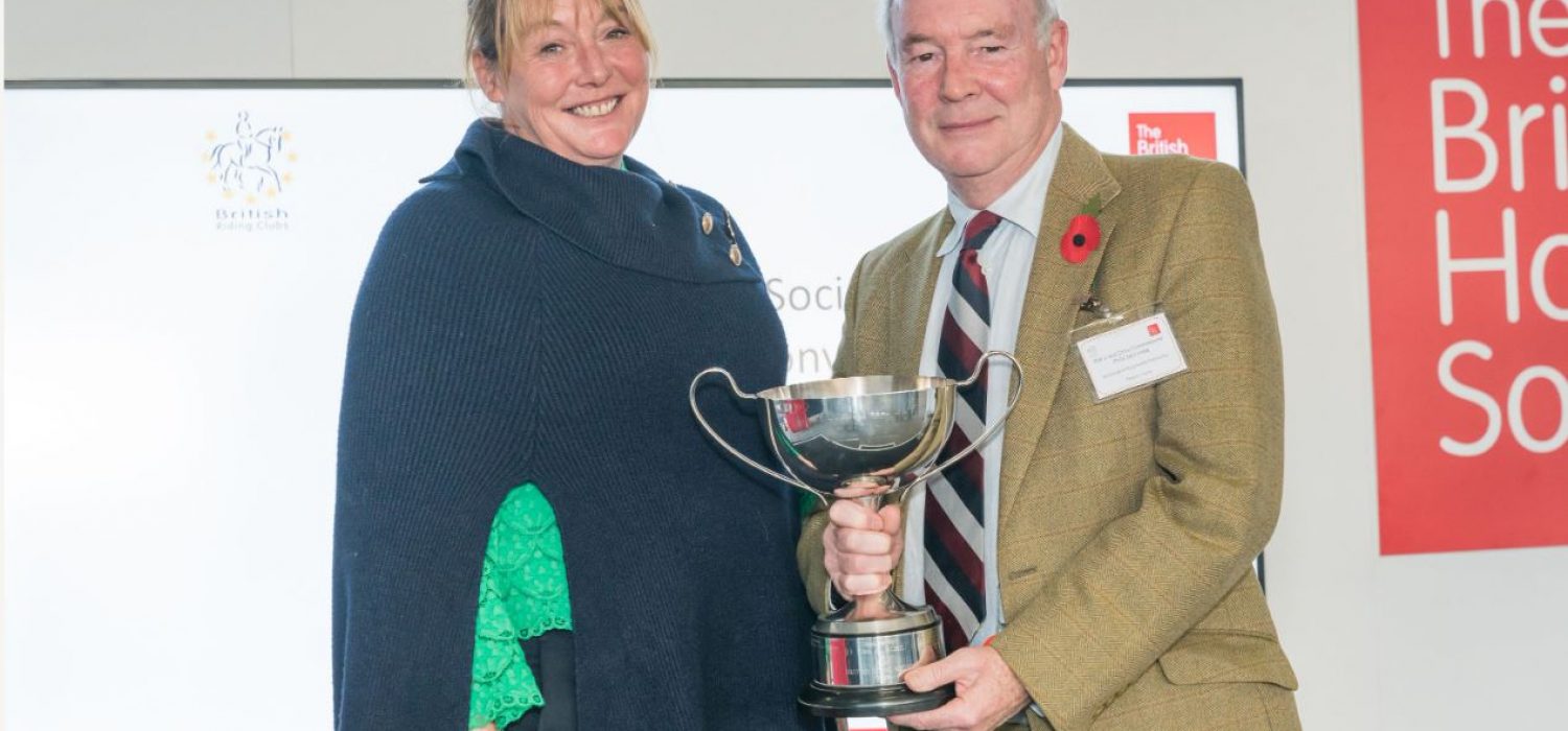 Philip Seccombe, Chair of Warwickshire Road Safety Partnership receiving The BHS Tarquin Trophy from BHS Ambassador Lizzie Greenwood Hughes